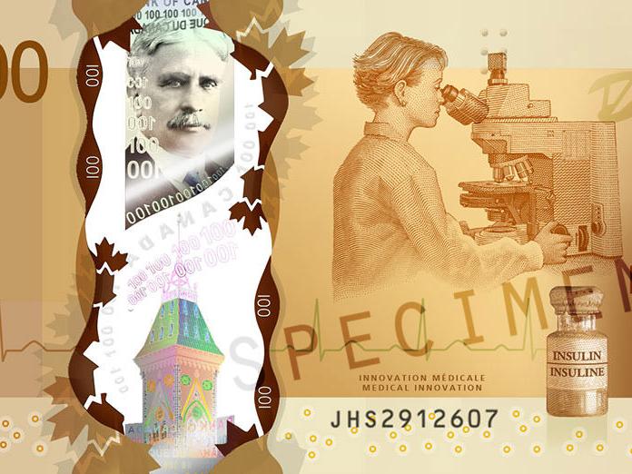 カナダの100ドル紙幣の拡大写真で、その他の中にツァイスの顕微鏡が描かれています。